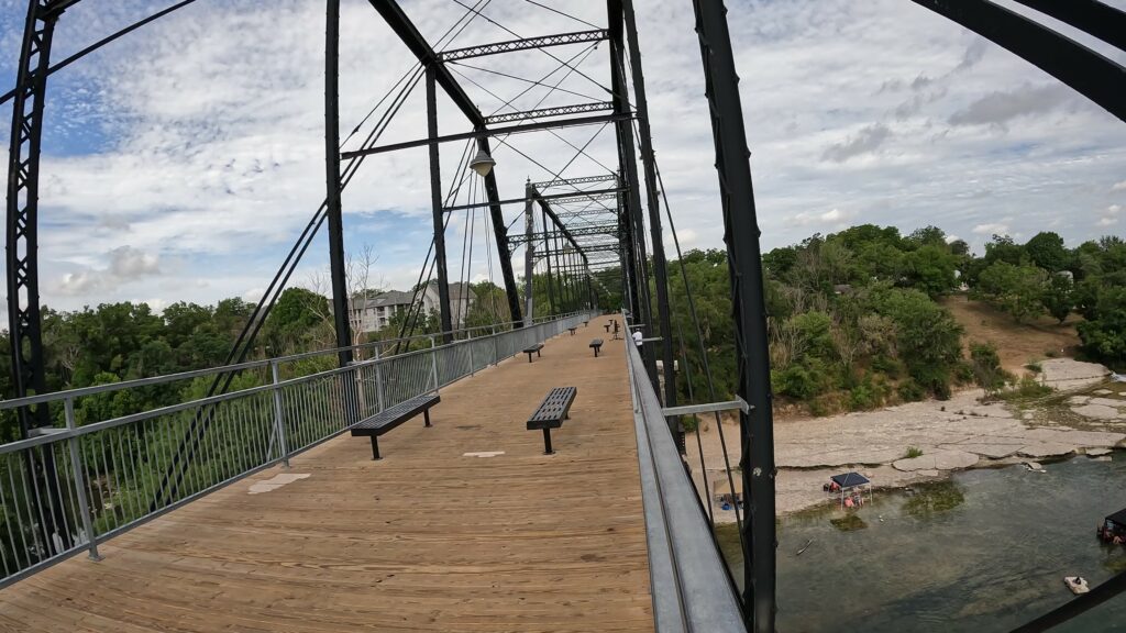 The Faust Street Bridge with Person Climbing Over the Side