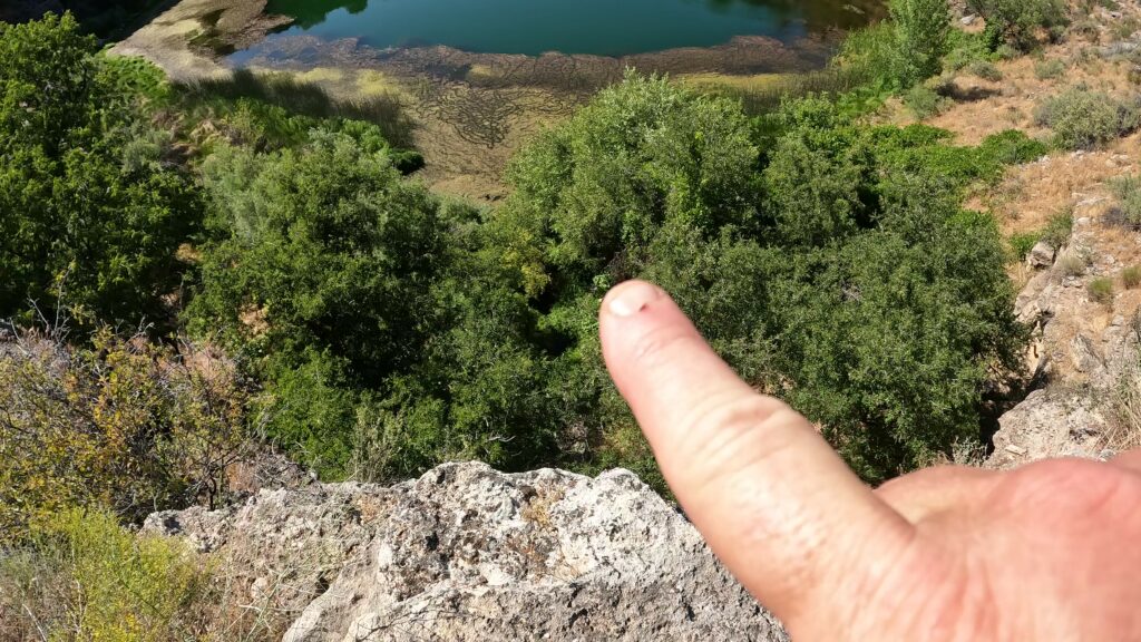 Pointing at the Outlet from the Well to the Verde River